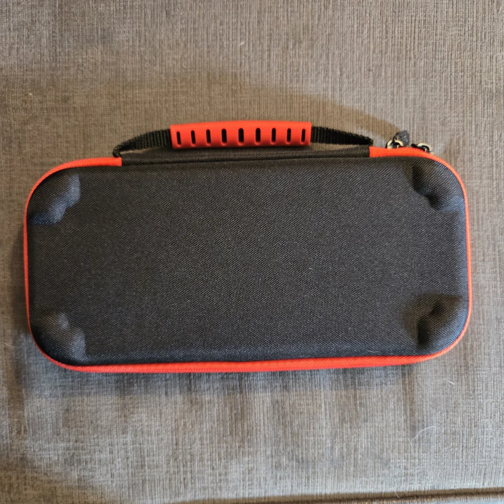 Official Nintendo Switch Red and Black Carrying Case With Microfiber Cloth.